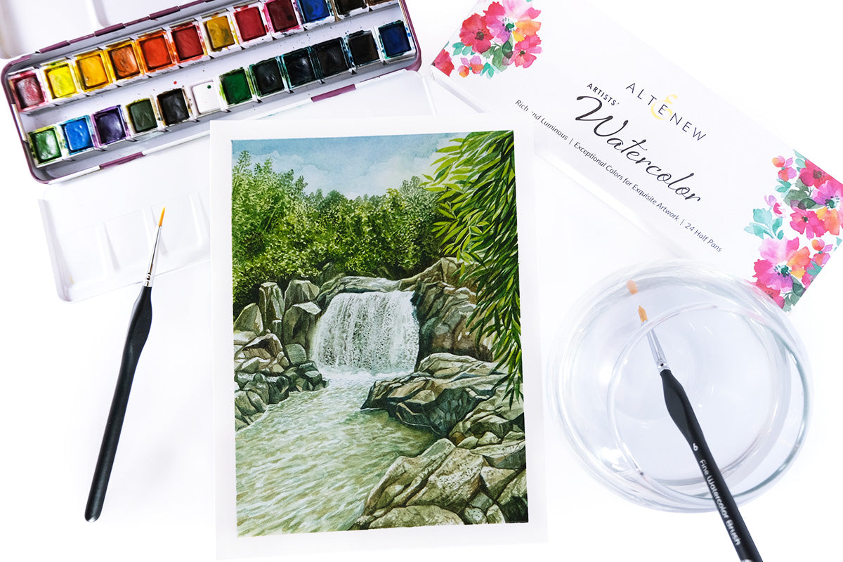 A watercolor painting of a small waterfalls, painted using Artistry's artist-grade watercolor pans