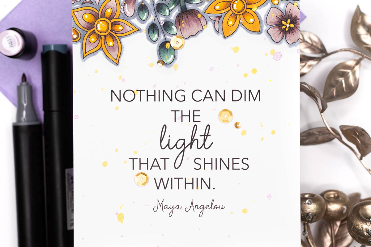 a handmade card decorated with marker colored flowers and stamped with a quote from Maya Angelou