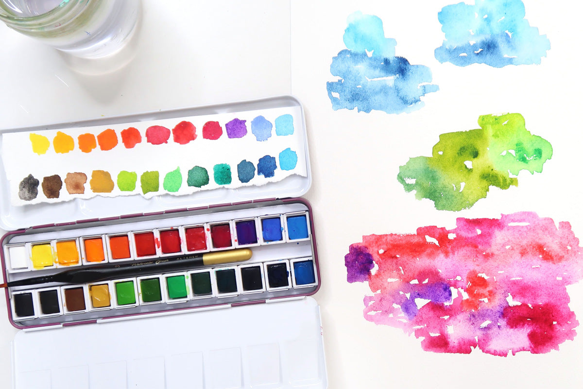 A watercolor swatch of vibrant colors on a palette