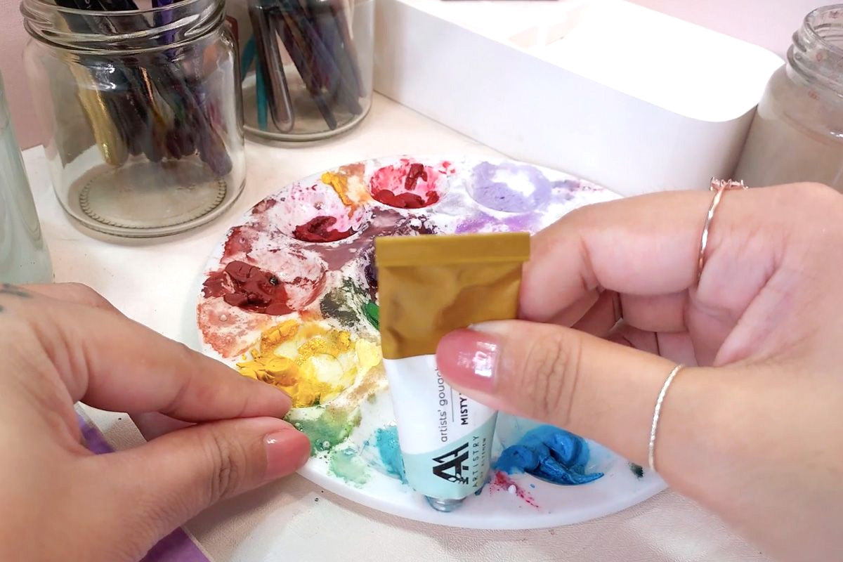 A swatch of gouache colors on a palette