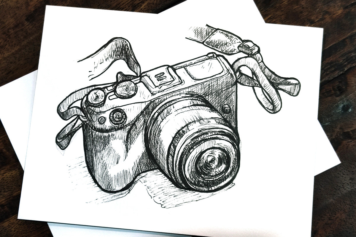 A drawing of a DSLR camera, made with Artistry pencils and fine line pens
