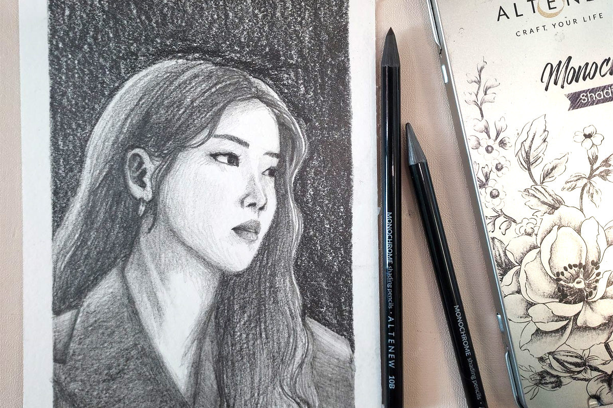 A black and white sketch of a woman created with Artistry Monochrome Shading Pencils