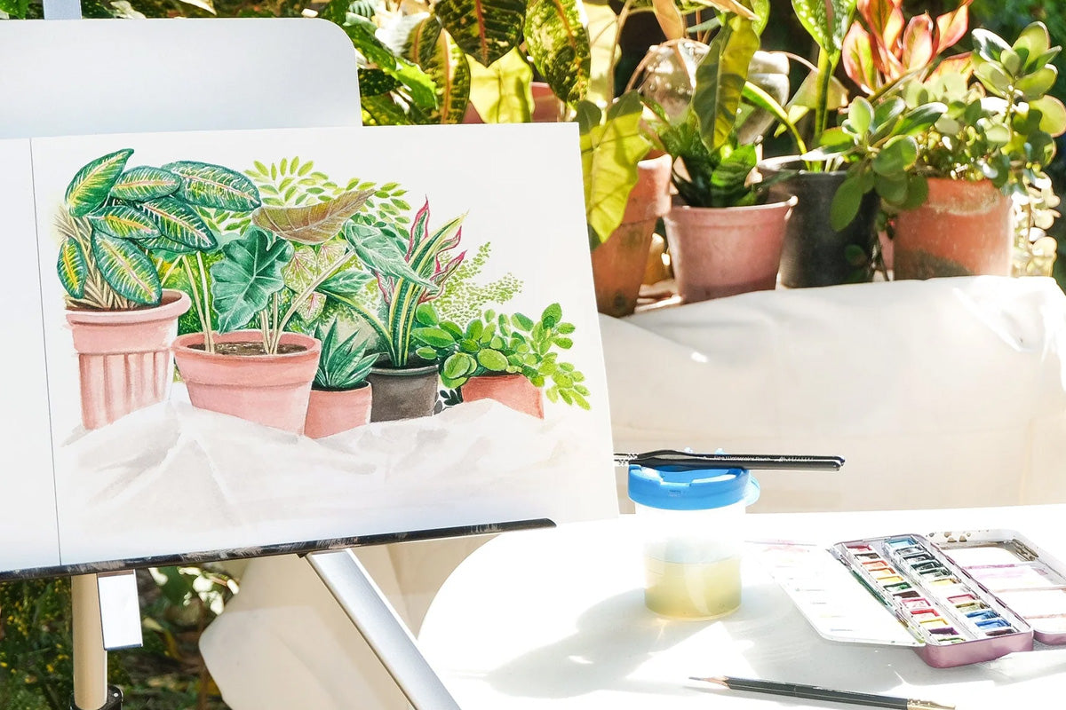 Plein air painting of potted plants, created with watercolor pans