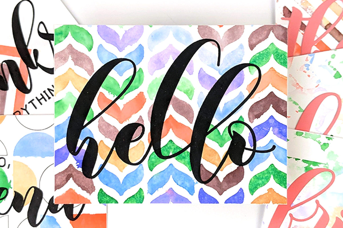 A greeting card with a colorful background created with Artistry by Altenew's Watercolor Brush Markers
