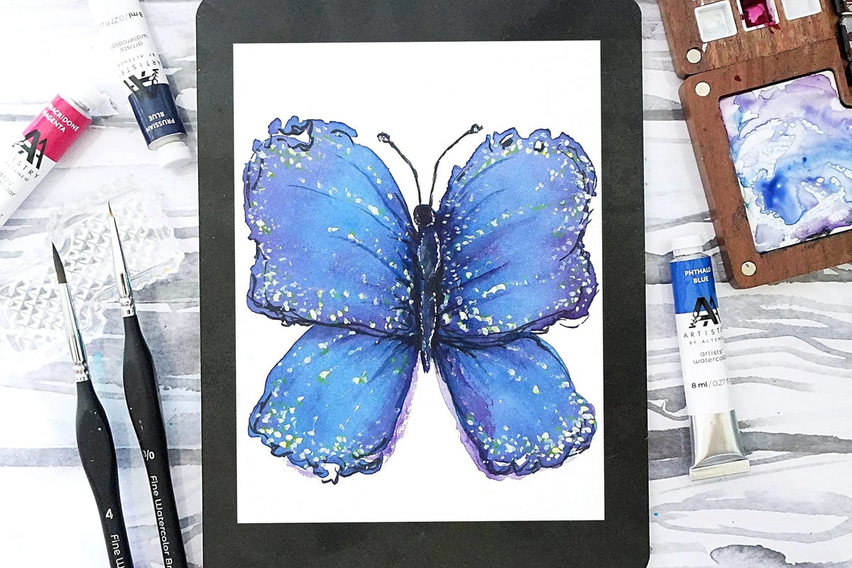 A painting of a large blue butterfly created with Artistry by Altenew's Watercolor Tubes