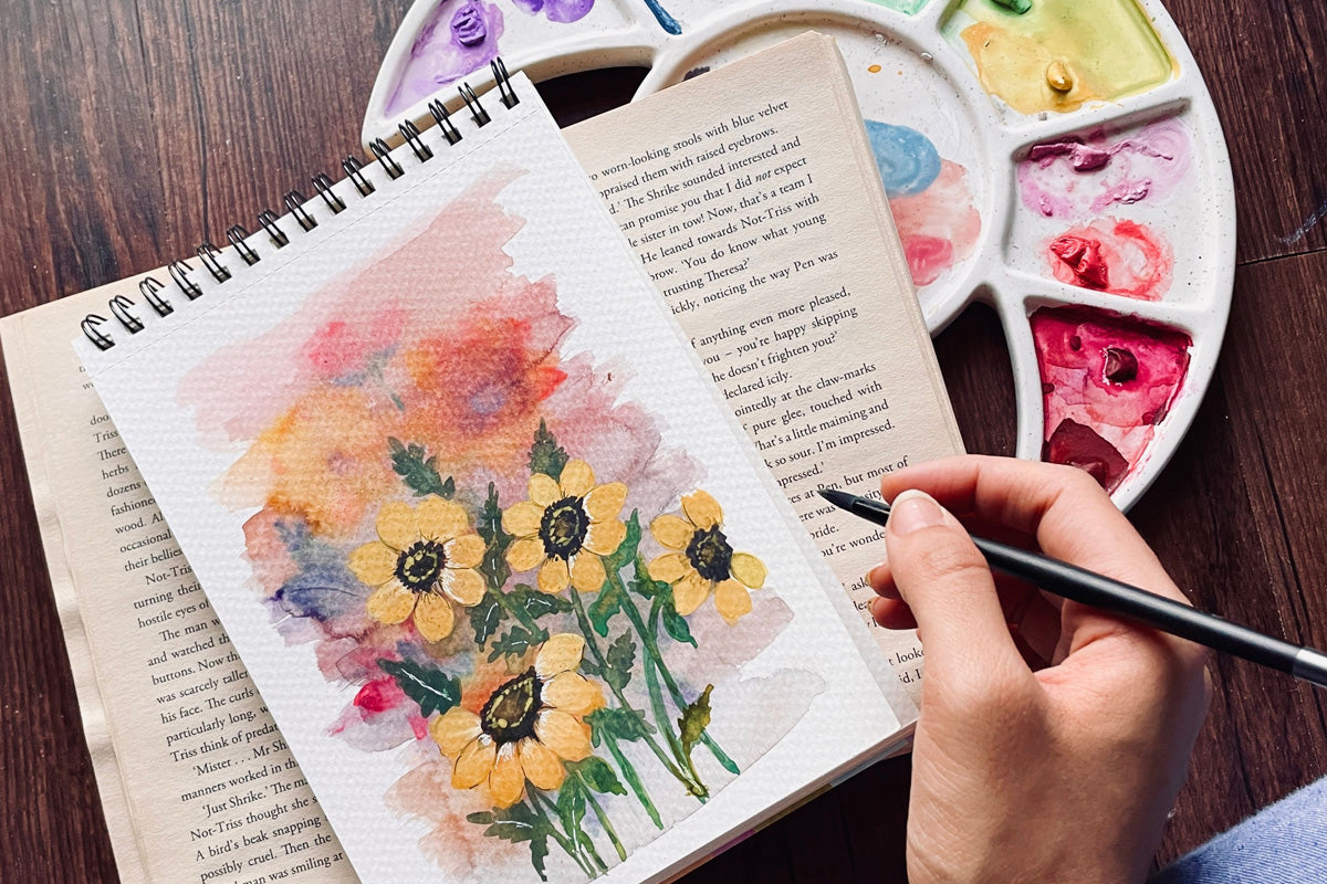 A watercolor painting of yellow flowers, painted with Artistry by Altenew watercolors