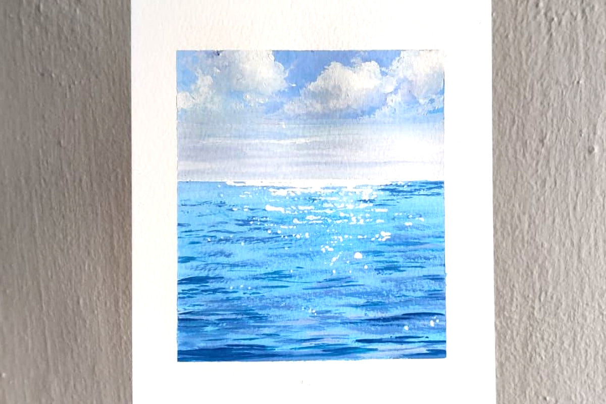 A painting of the ocean and blue skies