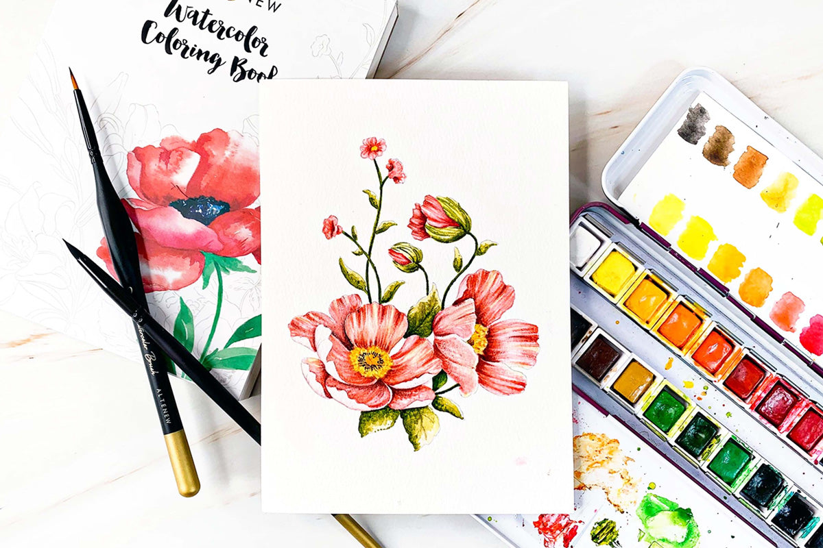 A page out of Artistry Watercolor Coloring Book featuring a couple of flowers painted using Artists' Watercolor 24 Pan Set