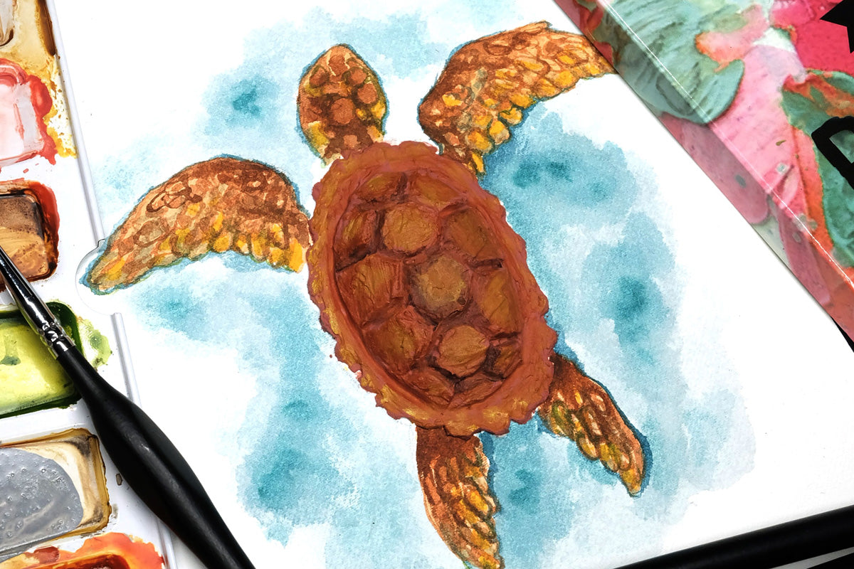 A turtle created with mixed media materials - embossing paste, watercolors, gouache paints, and palette knife