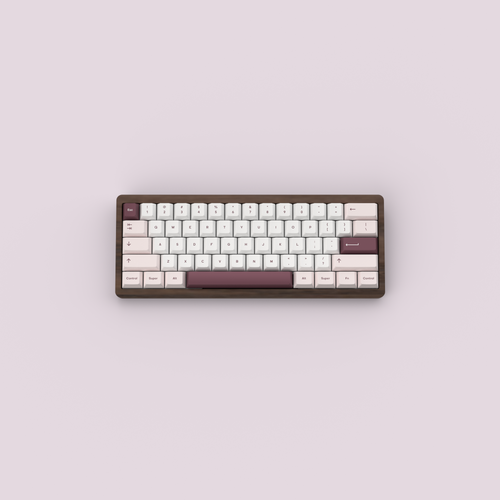 RENDER: Teacaps Rosewater keycaps on a walnut wood keyboard against a pink background.