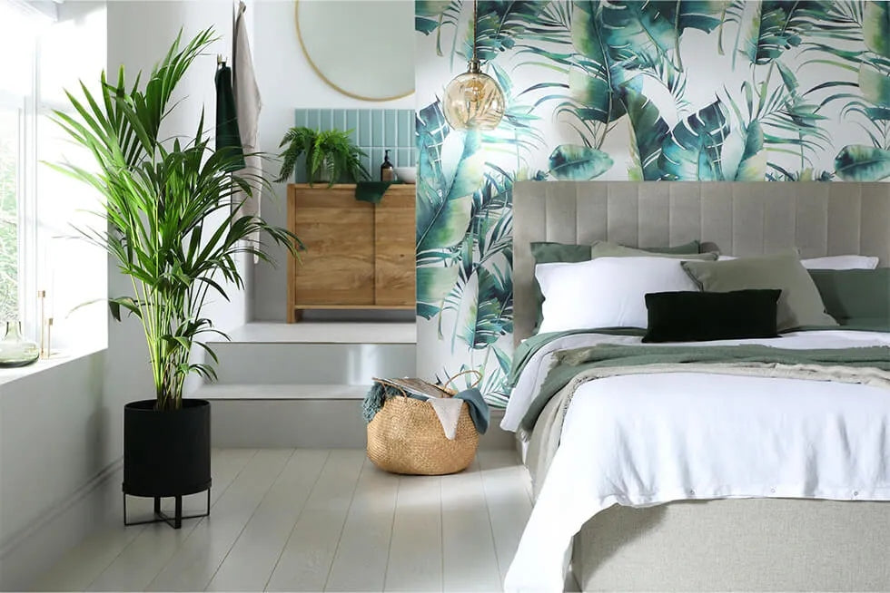 a bedroom with tropical wallpaper