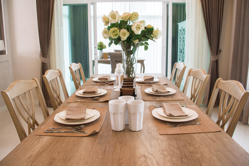 a wooden dining table and chairs