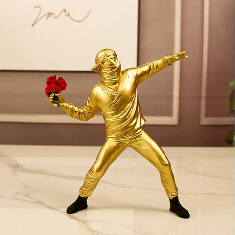 Man Figurine Throws Flower Statue