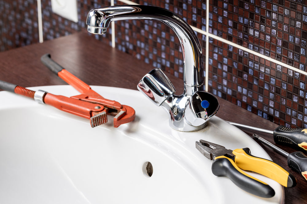 Plier and other material to fix a bathroom faucet issues