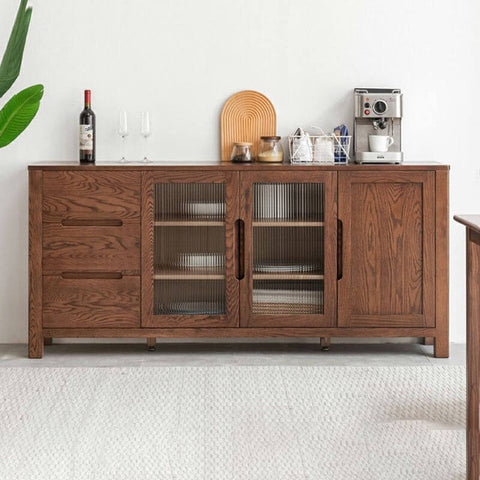 a wooden sideboard with glass doors