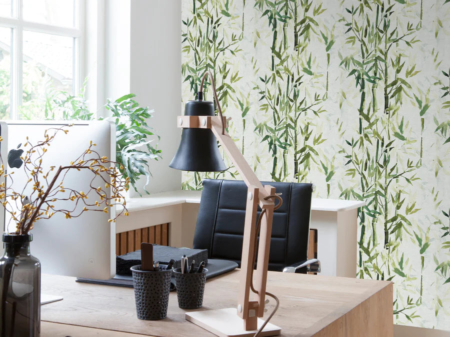 Green leaf wallpaper in a home office space.