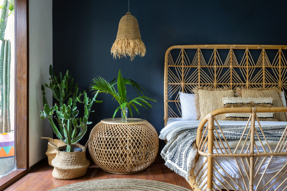 a bedroom with rattan furniture