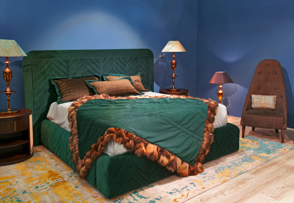 Deep Blues bedroom walls and a green bed