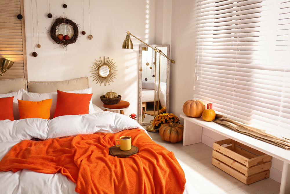 a bedroom filled with fall bedspread colors