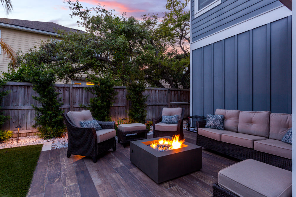 a backyard with a fire pit