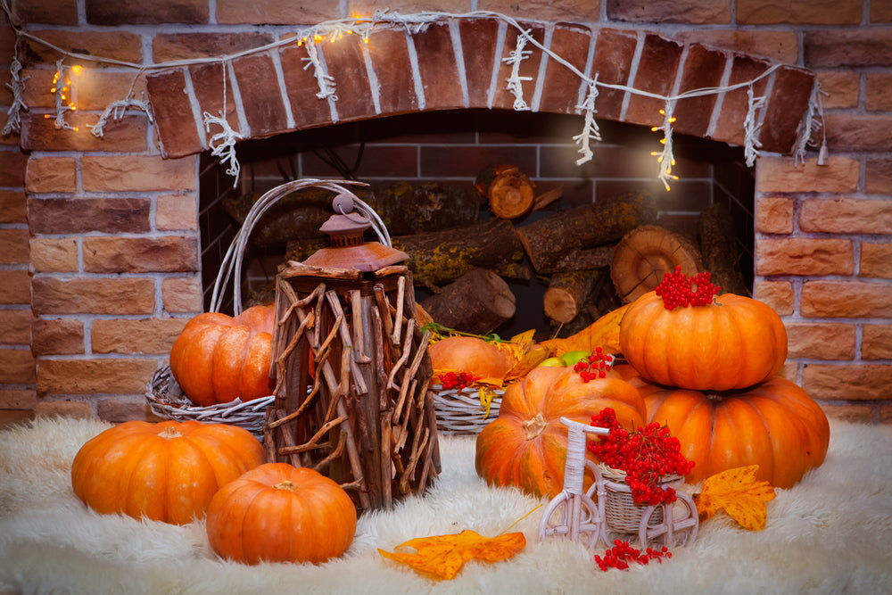 a fireplace filled with pumpkins