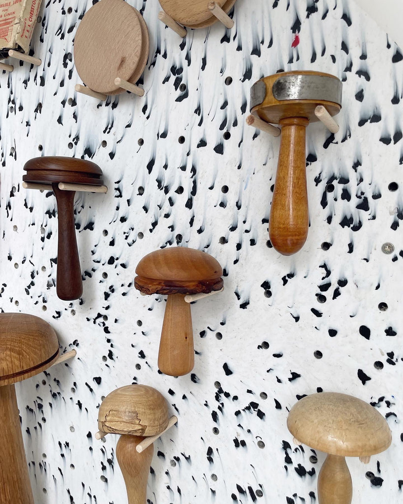 vintage darning mushrooms display