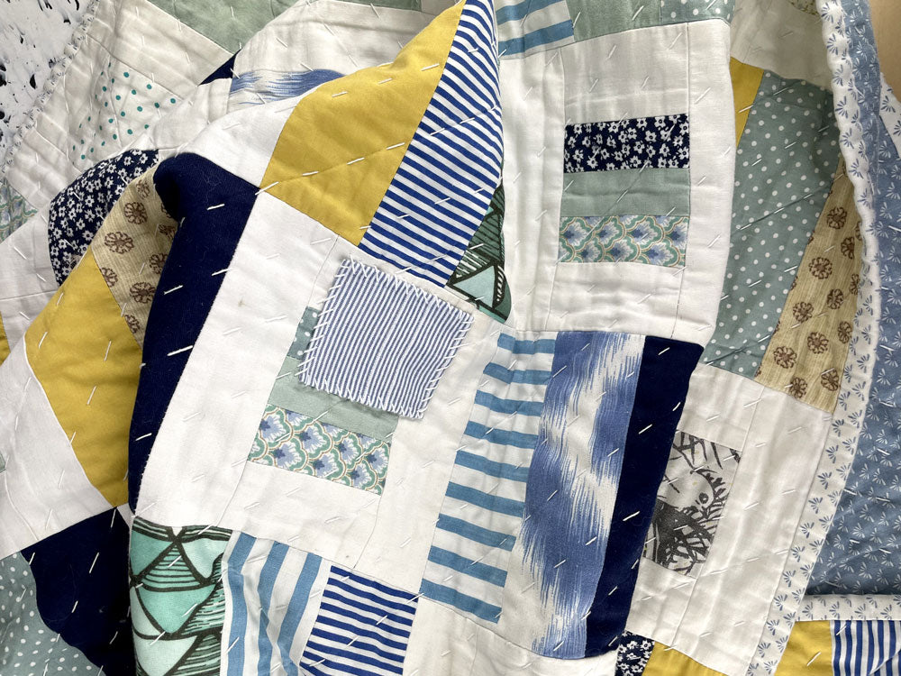 hand made quilt patch repair using visible mending by slow stitch club