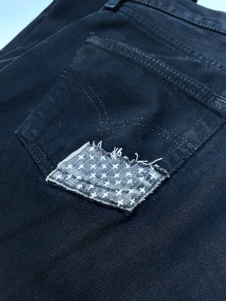 sashiko crosses visible mending on levis 501 jeans