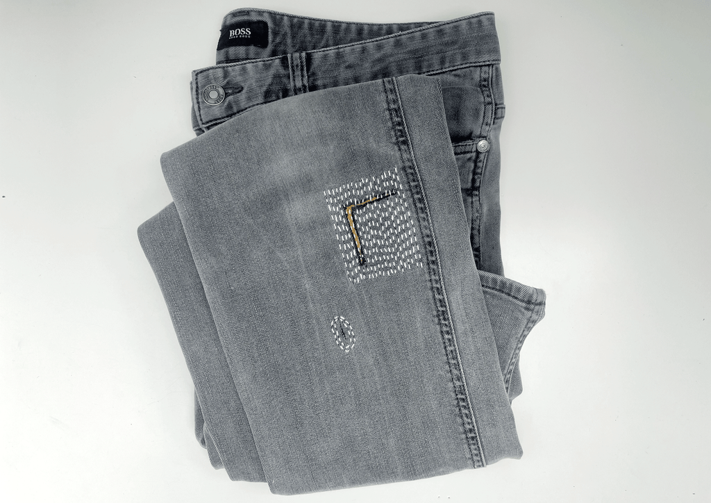 sashiko patch repair on hugo boss jeans by slow stitch club