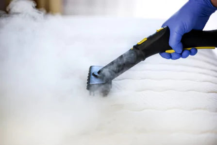 Cleaning a mattress with steam cleaner for bed and mattress care guide