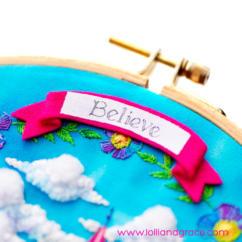 Closeup photo of the "believe" banner on the Lolli and Grace One Meaningful Word #8 stitch along