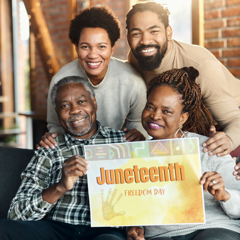 Family holding Juneteenth sign