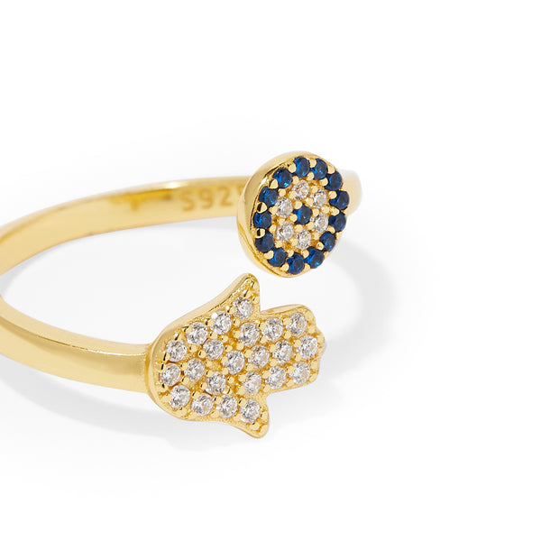Trendy gold-plated Hamsa Hand ring featuring a vibrant blue Evil Eye stone, symbolizing protection and good fortune, from La Maya's affordable fashion jewellery collection.