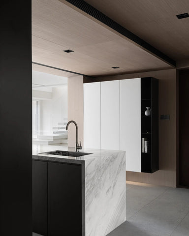 White marble worktop on the other side of the modern spliced ​​wooden dining table