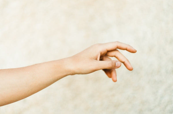 Hands floating in the field.