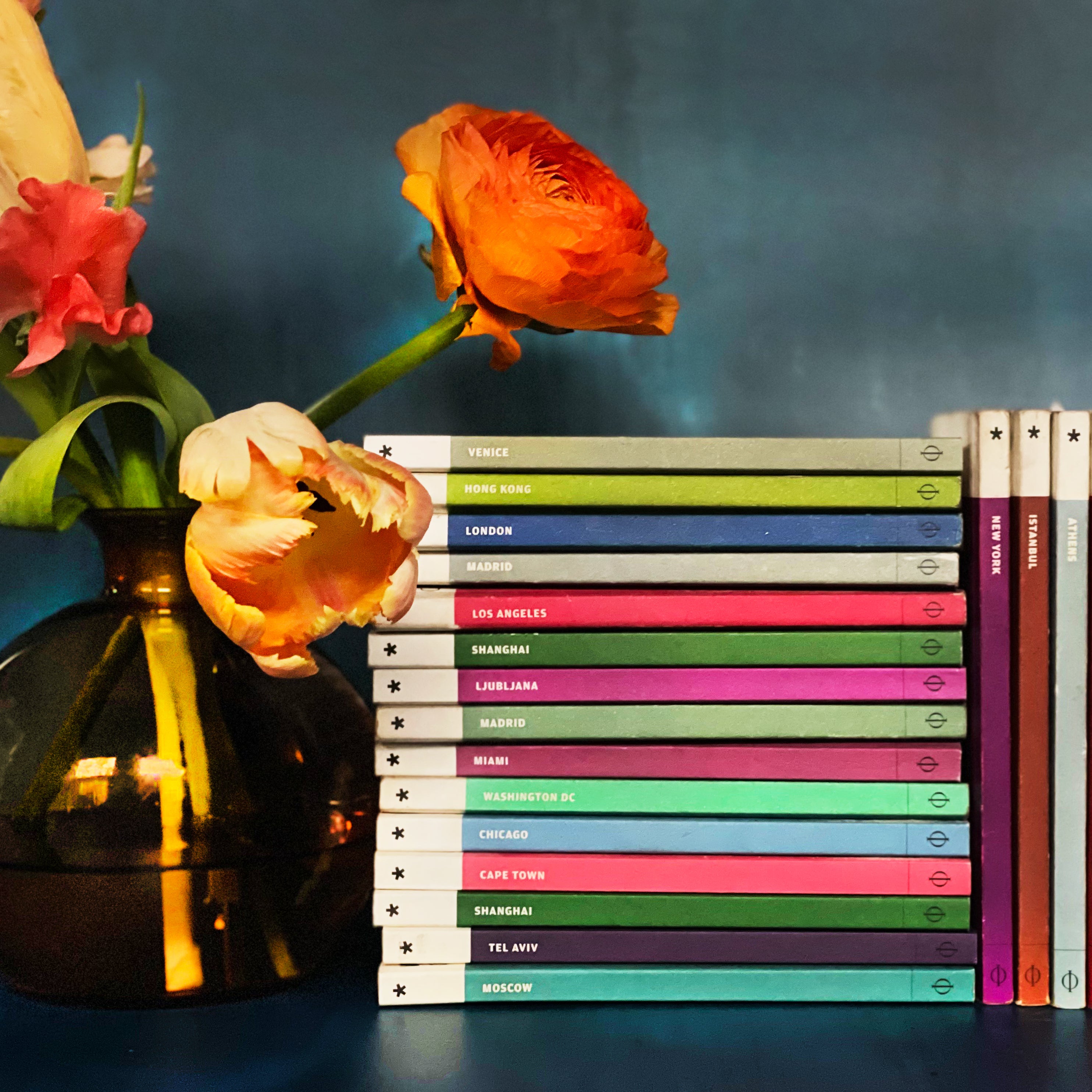 Books on shelf with flowers