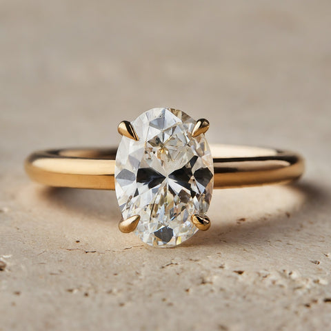 yellow gold oval solitaire engagement ring with claw prongs