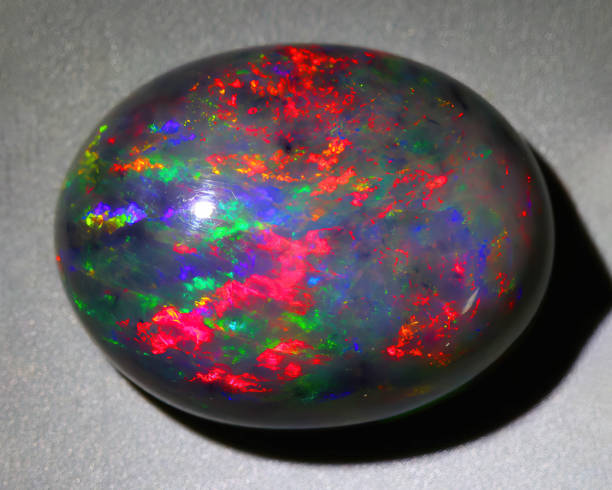 A polished black opal with prominent opalescence