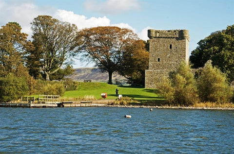 Loch Leven castle with hills and loch | Via. www.visitscotland.com