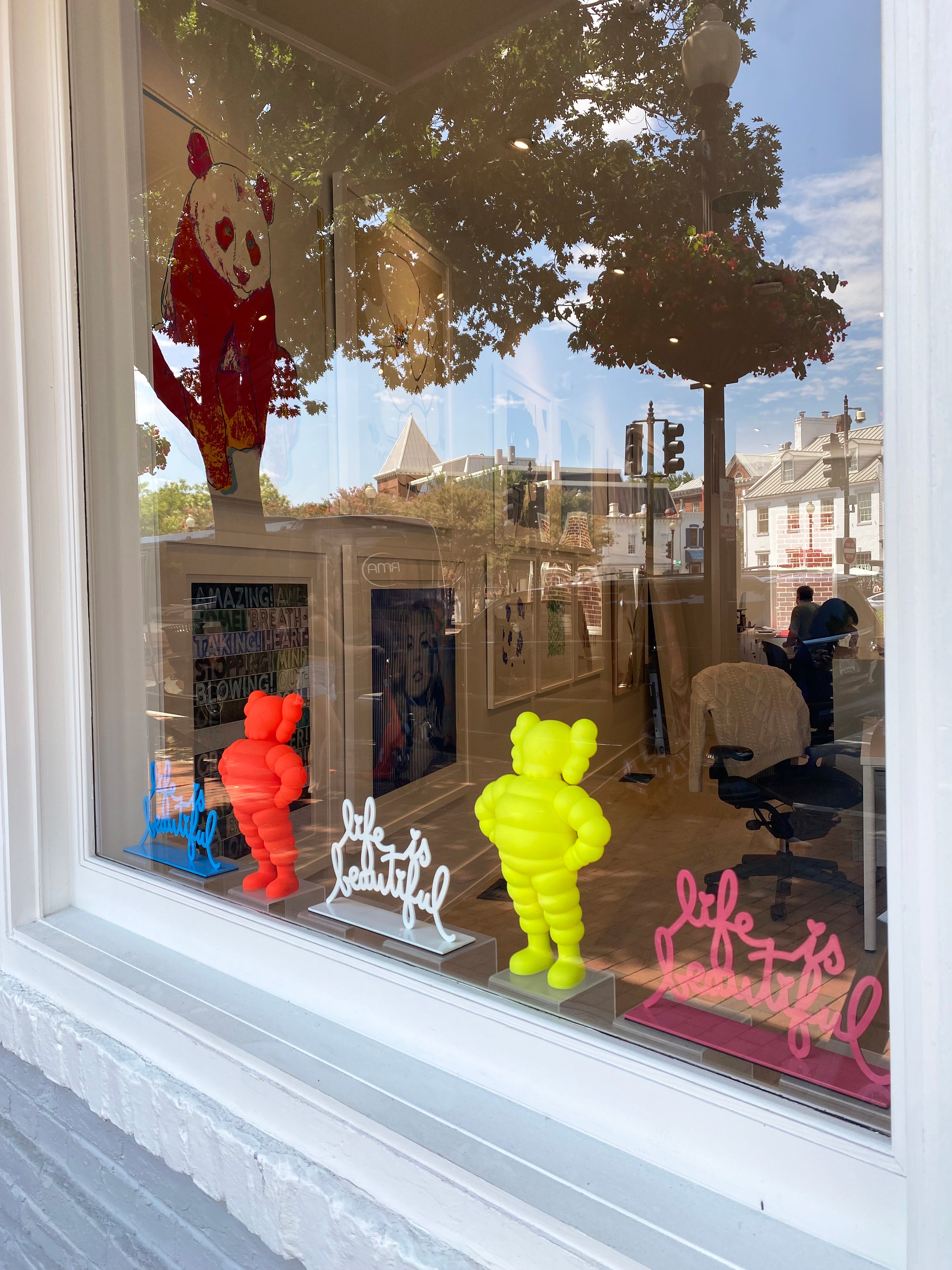 Window Display with KAWS Chum Figures and Mr. Brainwash Life is Beautiful Sculptures