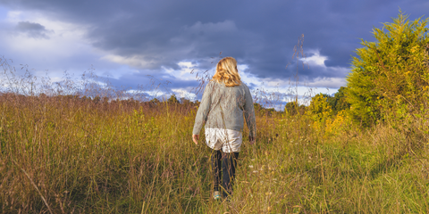 woman walking in a field