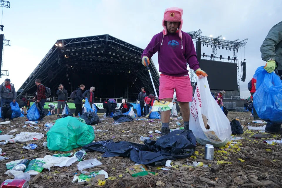 Man With Grabber Tool Picks Up Trash After Music Festival