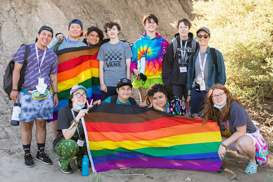 A Group Of Brave Trails Campers Holding A Pride Flag