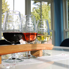 Photo of three wine glasses with wine.