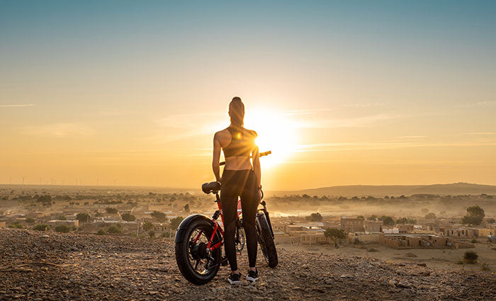 women electric bike and sunshine - oolactive
