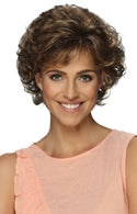 Model wearing curly shoulder length wig Nadia