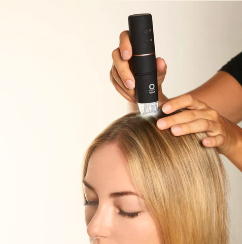 This image showcases a woman in the process of having her scalp assessed with the Oway Tricho-Derm. This image is used in the Ippodaro Natural Salon blog titled, “Unhealthy Scalp: Red Flags to Watch Out For and How to Treat Them”.