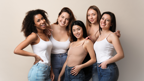 This image showcases five girls with different hair types wearing jeans with neutral color tanktops. This image is used in the Ippodaro Natural Salon blog post titled, “The Reason Behind the 5-6 Week Rule For Color Maintenance”.