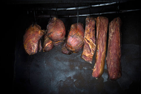 Meat hanging in food smoker