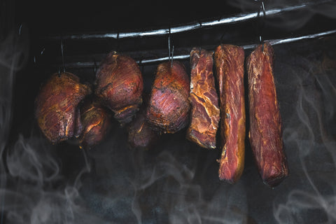 Meats getting smoked at food smoker